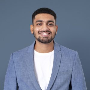 Cheerful Indian businessman smiling closeup portrait for jobs and career campaign